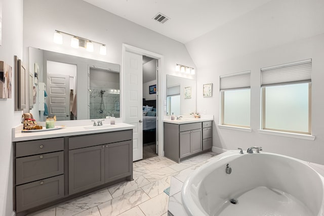 4107 Maple Glen Dr, Fulshear, TX 77441 - bathroom with ensuite bathroom, marble look tiles, lofted ceiling, a shower stall, and two vanities