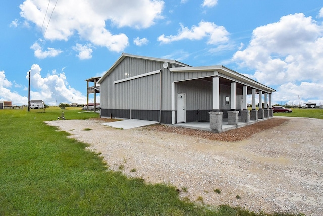 263 Kingfish Ln, Palacios, TX 77465 - view of side of home with a lawn
