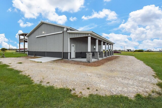263 Kingfish Ln, Palacios, TX 77465 - view of side of property featuring a lawn