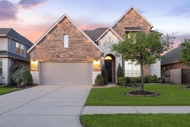 19534 Juniper Breeze Ln, Spring, TX 77379 - view of front facade featuring brick siding, concrete driveway, stone siding, and a garage