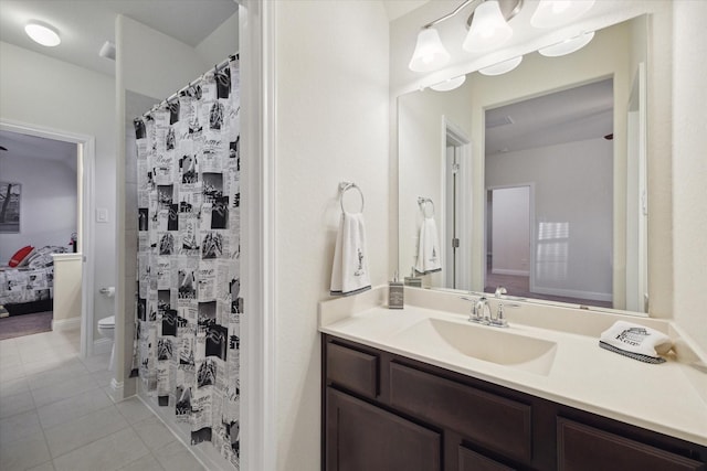 19534 Juniper Breeze Ln, Spring, TX 77379 - bathroom featuring tile patterned floors, toilet, and vanity