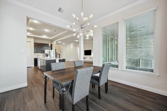 19534 Juniper Breeze Ln, Spring, TX 77379 - dining room with ornamental molding, a chandelier, dark wood-style floors, baseboards, and stairway