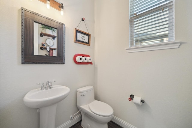 19534 Juniper Breeze Ln, Spring, TX 77379 - half bath featuring baseboards, toilet, and wood finished floors