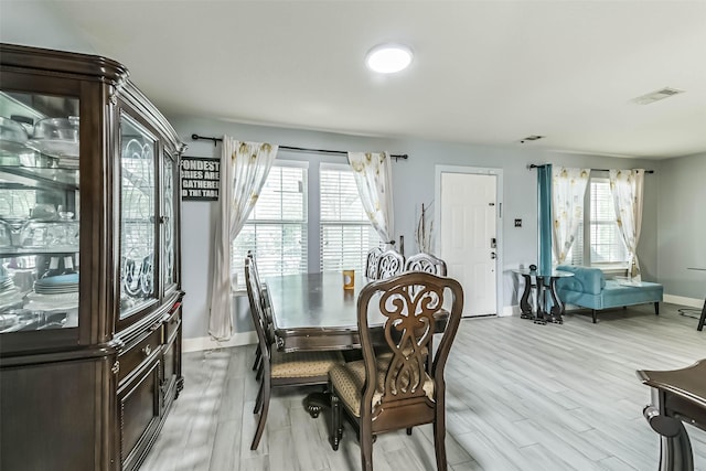 19942 Crested Hill Ln, Cypress, TX 77433 - dining space with baseboards, light wood-style floors, and plenty of natural light