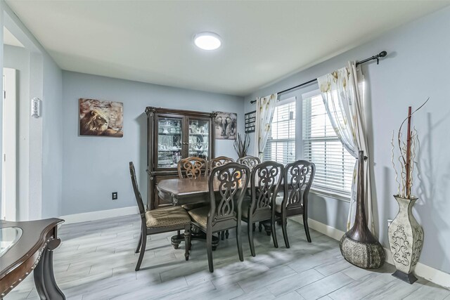 19942 Crested Hill Ln, Cypress, TX 77433 - dining room with baseboards and light wood finished floors