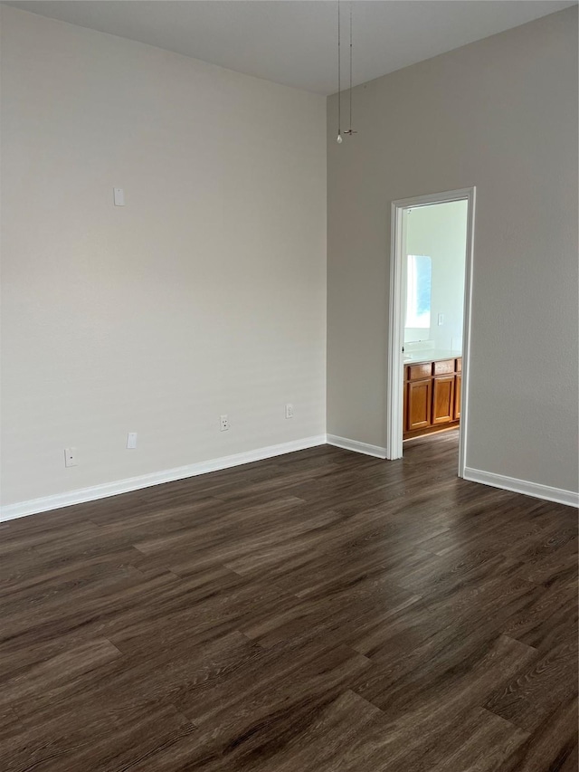 2702 Orchard Creek Ln, Katy, TX 77494 - spare room with baseboards and dark wood-style floors