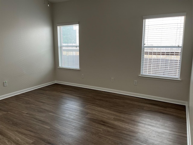 2702 Orchard Creek Ln, Katy, TX 77494 - empty room featuring dark wood-style floors and baseboards