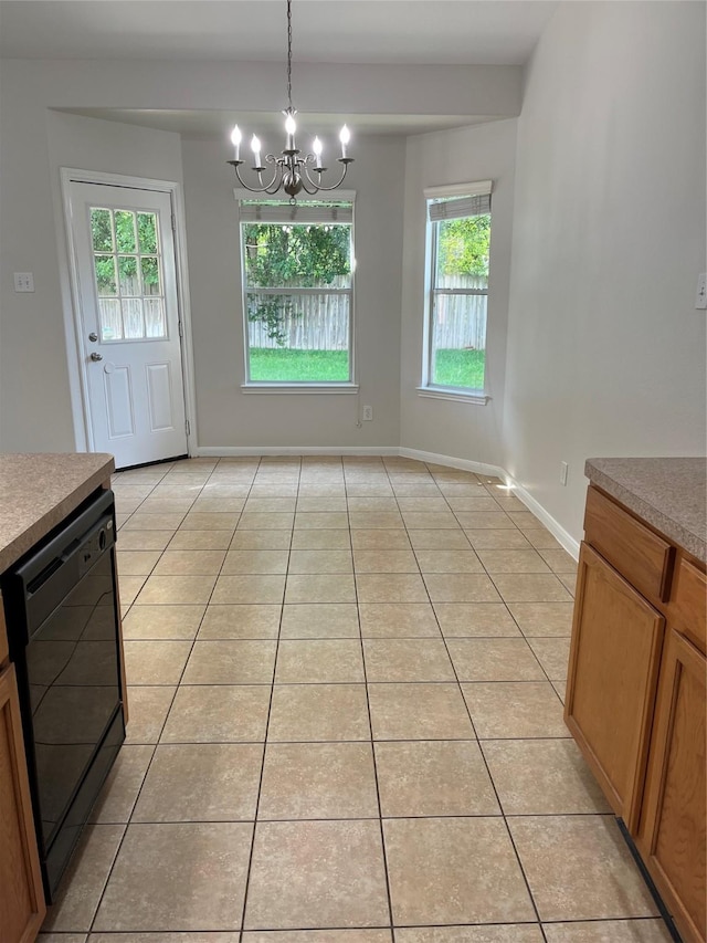 2702 Orchard Creek Ln, Katy, TX 77494 - unfurnished dining area with light tile patterned floors, a chandelier, and baseboards