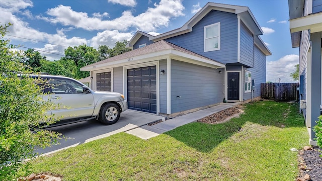 501-509 Hines Ave, Willis, TX 77378 - view of side of home featuring driveway and a garage