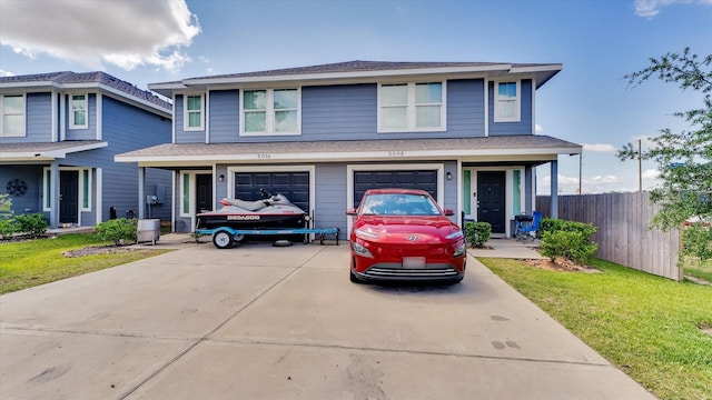 501-509 Hines Ave, Willis, TX 77378 - view of front facade featuring driveway, roof with shingles, and an attached garage