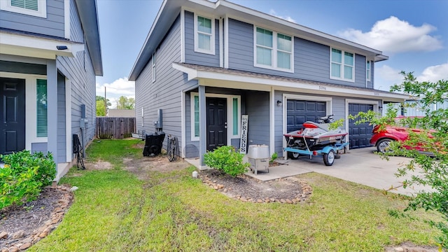 501-509 Hines Ave, Willis, TX 77378 - view of front of property with a garage and driveway