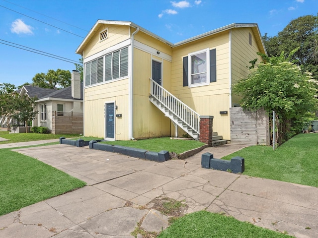 1811 39th St, Galveston, TX 77550 - view of front of home featuring stairway and a front lawn