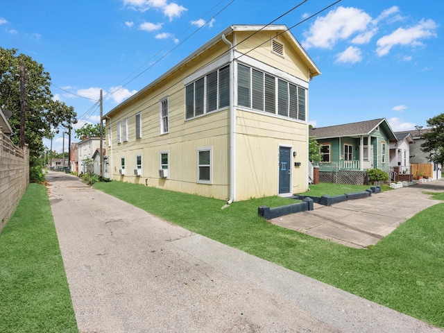 1811 39th St, Galveston, TX 77550 - view of home's exterior featuring a lawn
