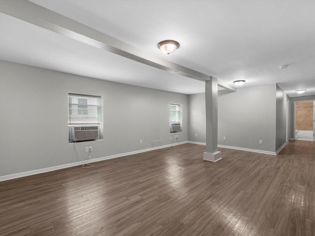 1811 39th St, Galveston, TX 77550 - unfurnished living room with cooling unit, baseboards, and dark wood-style floors