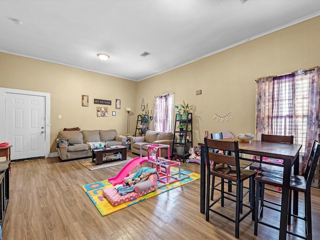 1811 39th St, Galveston, TX 77550 - dining space with wood finished floors and ornamental molding
