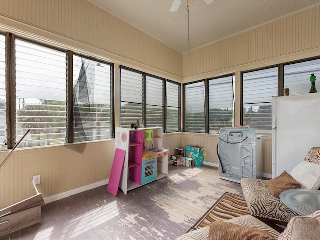 1811 39th St, Galveston, TX 77550 - sunroom with wood-type flooring, plenty of natural light, baseboards, and wood walls