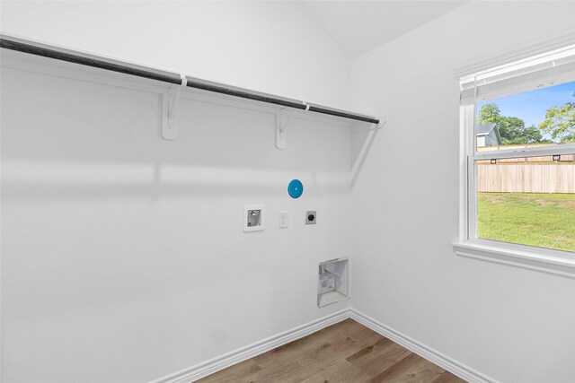 12672 Lake Conroe Hls, Conroe, TX 77318 - washroom featuring hookup for an electric dryer, wood finished floors, and hookup for a washing machine