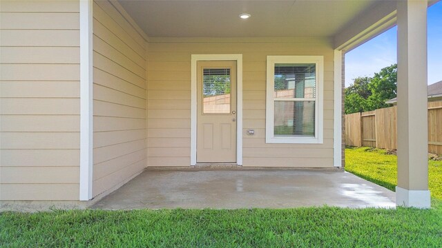 12672 Lake Conroe Hls, Conroe, TX 77318 - view of exterior entry with a patio