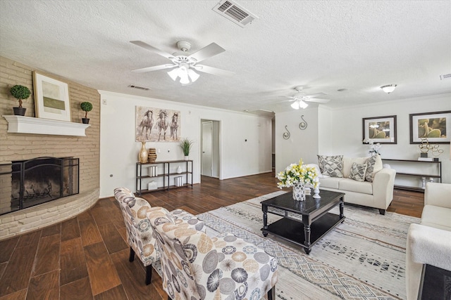 5939 Rutherglenn Dr, Houston, TX 77096 - living area featuring ceiling fan, wood finished floors, a textured ceiling, a fireplace, and crown molding
