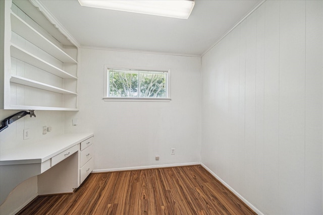 5939 Rutherglenn Dr, Houston, TX 77096 - unfurnished office featuring dark wood-type flooring, built in desk, baseboards, and crown molding