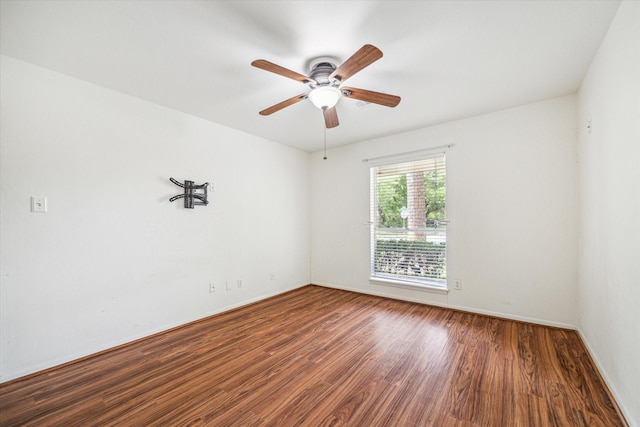 5939 Rutherglenn Dr, Houston, TX 77096 - empty room with wood finished floors, ceiling fan, and baseboards
