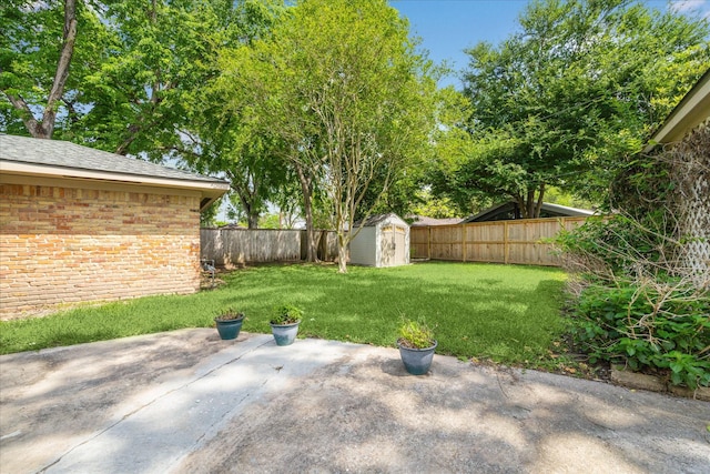 5939 Rutherglenn Dr, Houston, TX 77096 - view of yard featuring a patio, a storage unit, and an outbuilding