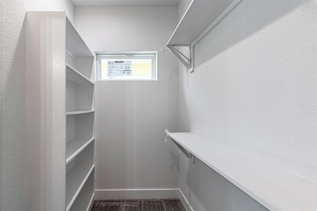 2022 Wavell St, Houston, TX 77088 - spacious closet featuring dark colored carpet