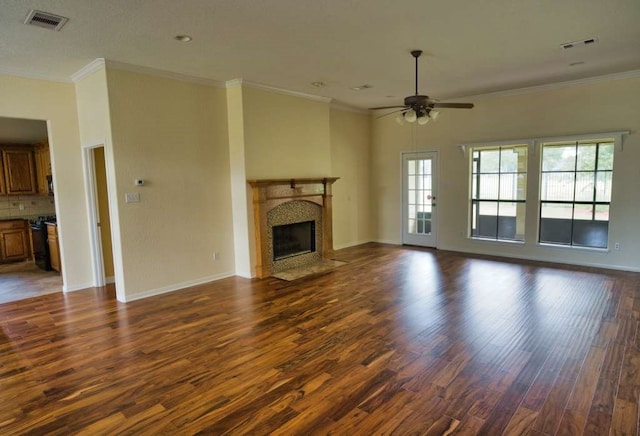 108 Madison Ave, Clute, TX 77531 - unfurnished living room featuring dark wood-style floors, ceiling fan, a high end fireplace, crown molding, and baseboards