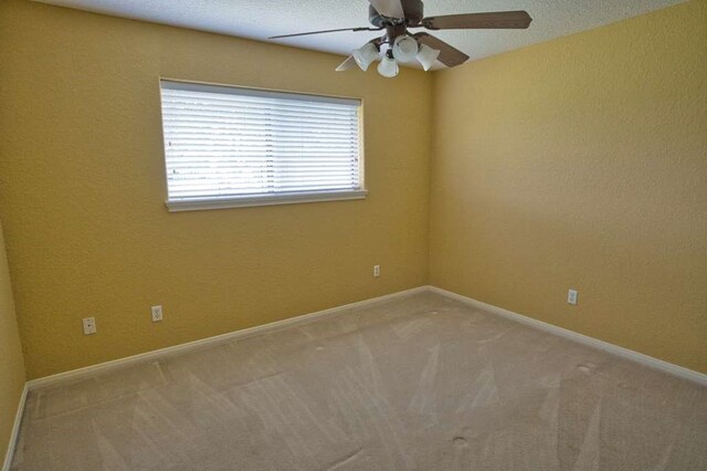 108 Madison Ave, Clute, TX 77531 - empty room with a ceiling fan, light colored carpet, and baseboards