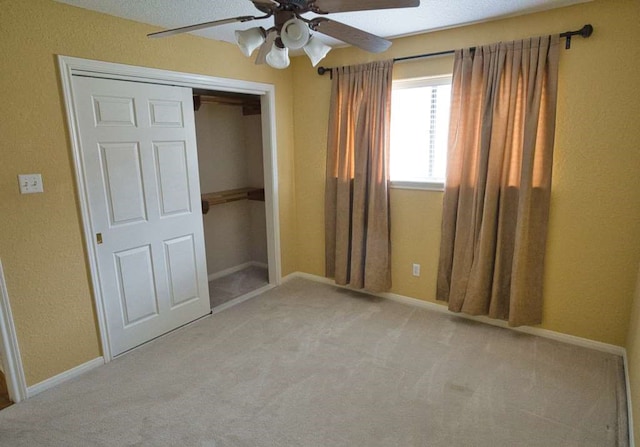 108 Madison Ave, Clute, TX 77531 - unfurnished bedroom featuring carpet flooring, a closet, and ceiling fan
