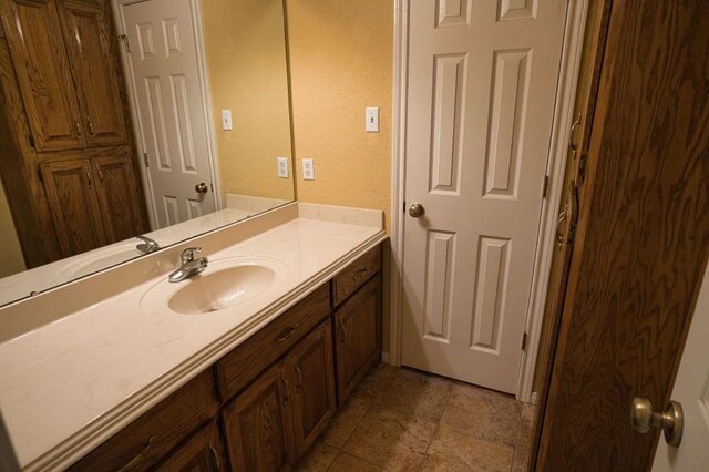 108 Madison Ave, Clute, TX 77531 - bathroom featuring vanity and a textured wall