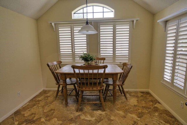 108 Madison Ave, Clute, TX 77531 - dining space with lofted ceiling and baseboards