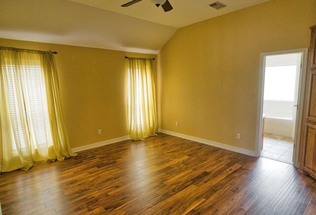 108 Madison Ave, Clute, TX 77531 - spare room with ceiling fan, wood finished floors, lofted ceiling, and baseboards