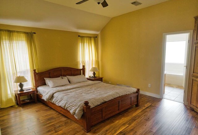 108 Madison Ave, Clute, TX 77531 - bedroom featuring multiple windows, wood finished floors, vaulted ceiling, and a ceiling fan