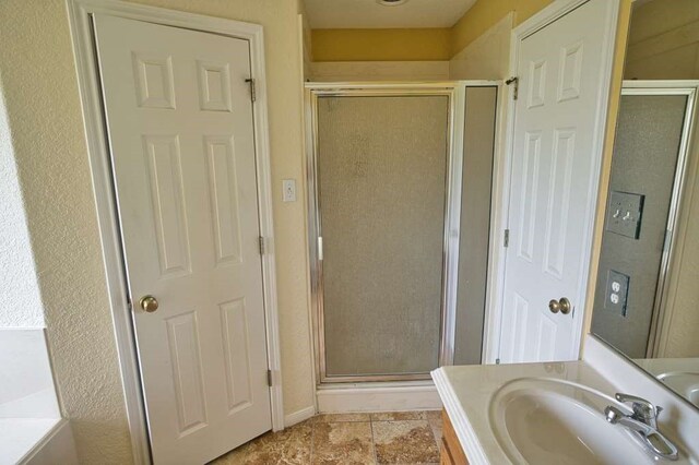 108 Madison Ave, Clute, TX 77531 - full bathroom with a stall shower and vanity