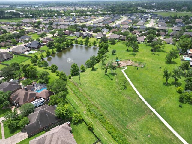108 Madison Ave, Clute, TX 77531 - aerial view of property and surrounding area with a large body of water and nearby suburban area