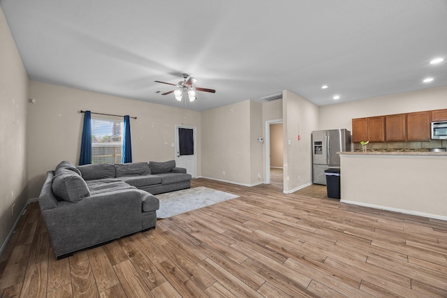 6026 Coleus St, Crosby, TX 77532 - living area with light wood-style floors, a ceiling fan, baseboards, and recessed lighting