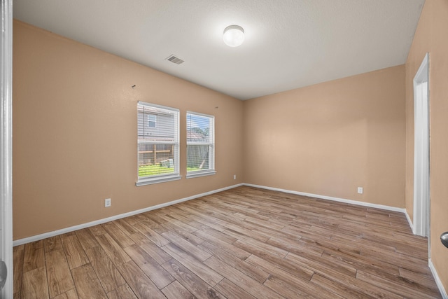 6026 Coleus St, Crosby, TX 77532 - unfurnished room with wood finished floors and baseboards