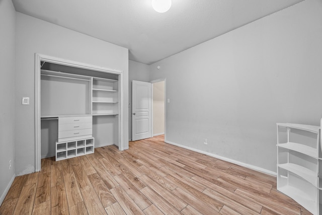 6026 Coleus St, Crosby, TX 77532 - unfurnished bedroom featuring wood finished floors, a closet, and baseboards