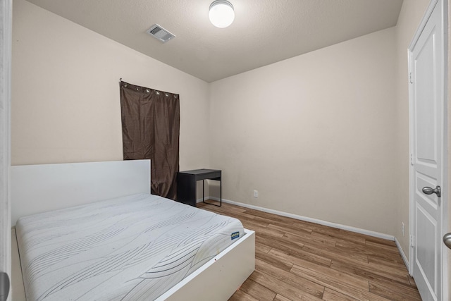 6026 Coleus St, Crosby, TX 77532 - bedroom featuring wood finished floors and baseboards