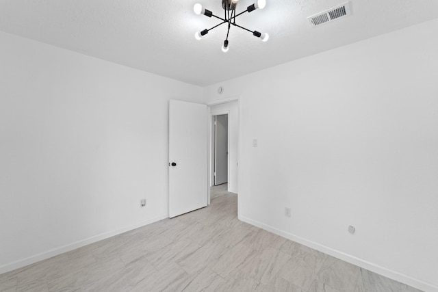 7511 Londres Dr, Houston, TX 77083 - spare room with a chandelier and baseboards