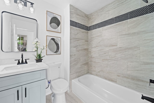 7511 Londres Dr, Houston, TX 77083 - bathroom featuring toilet, vanity, and shower / bathtub combination