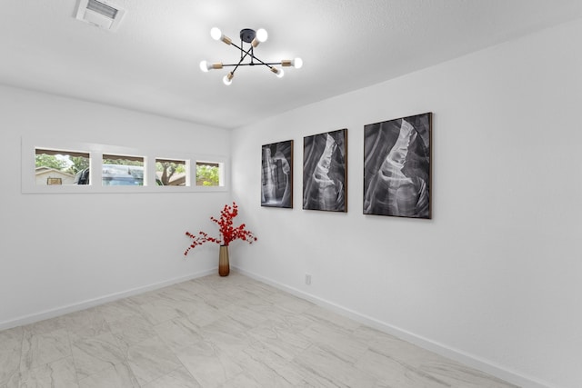7511 Londres Dr, Houston, TX 77083 - empty room with a chandelier and baseboards