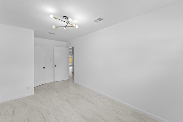 7511 Londres Dr, Houston, TX 77083 - unfurnished bedroom with a chandelier and baseboards