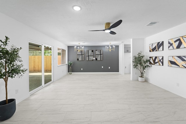 7511 Londres Dr, Houston, TX 77083 - spare room with a chandelier, ceiling fan, and baseboards