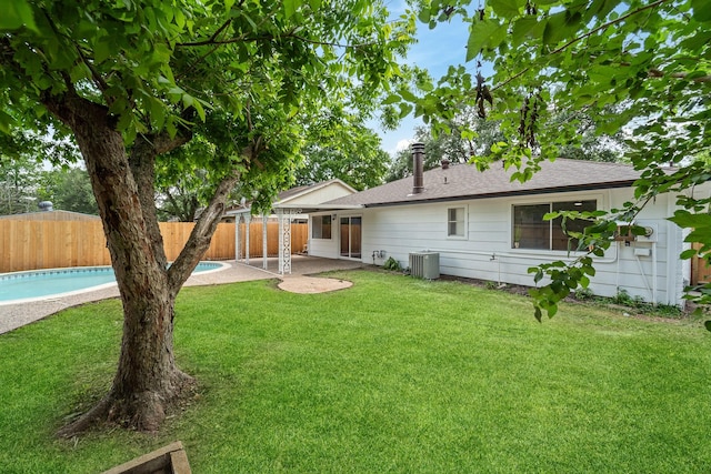 7511 Londres Dr, Houston, TX 77083 - back of house featuring cooling unit, a patio area, and roof with shingles