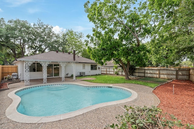 7511 Londres Dr, Houston, TX 77083 - view of pool with a patio area and central AC unit