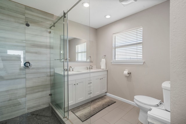 23401 Termini San Luis Pass Rd, Galveston, TX 77554 - bathroom featuring toilet, double vanity, a shower stall, tile patterned floors, and recessed lighting