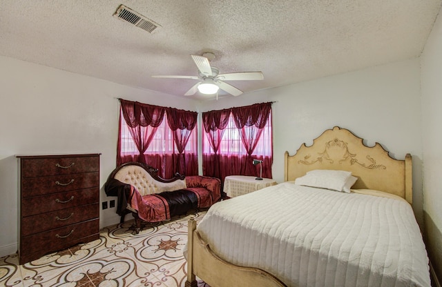 12313 Kayla Ln, Houston, TX 77015 - bedroom featuring a textured ceiling and a ceiling fan
