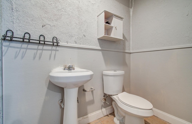 12313 Kayla Ln, Houston, TX 77015 - half bathroom featuring toilet and tile patterned floors